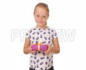 Get 100&#39;s of FREE Video Templates, Music, Footage and More at Motion Array: http://bit.ly/2SITwWM nnnGet this here: https://motionarray.com/stock-video/girl-gives-present-178118nnGirl Gives Present is an incredible stock video that exhibits footage of an adorable little girl giving a pretty pink gift with a yellow bow. This 1920x1080 (HD) video will look gorgeous in any video project that has to do with kindness, gifts and Christmas. This footage will look great in your next intro, YouTube video