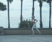 Get 100&#39;s of FREE Video Templates, Music, Footage and More at Motion Array: https://www.bit.ly/2UymF81nnnnGet this here: https://motionarray.com/stock-video/jog-past-palm-trees-143029nnThis video captures a woman jogging down a pier lined with palm trees. She is out for some early morning exercise. The girl listens to her headphones while she runs down the empty pier. She is wearing a white sports bra and leggings. The camera follows her as she passes. Use this clip to encourage daily exercise.
