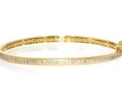 https://www.ross-simons.com/964649.htmlnnDont slack on your stack — add some sparkle! This satin and polished 18kt yellow gold over sterling silver bangle bracelet features a center stripe of .50 ct. t.w. diamonds in white rhodium. Figure 8 safety. Box clasp, diamond bangle bracelet.