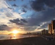 The sun sets on the Playa Levante in Benidorm, Spain. A timelapse of people walking up and down the beach.nFilmed: October 2012nMusic: n--------nTime Decay by Morgantj (2009) - Licensed under Creative Commons Sampling Plusnhttp://ccmixter.org/files/morgantj/22769n---n(M2630)