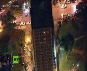WPVI-TV/6ABC Video from the helicopter shows a man scaling down the side of a high rise