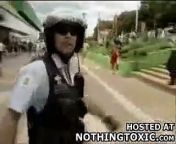 A Brazilian cop attempts to subdue a soccer rioter by pistol whipping him in the head. Unfortunately as he hits the guy the gun accidentally goes off shooting the guy in the head.