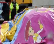 A shocking accident caught on camera shows an inflatable bouncy castle in China&#39;s Guangxi province come loose in a gust of wind and fly into the air, taking with it a 3-year-old girl who was playing inside.
