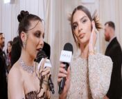 Emily Ratajkowski talks to Emma Chamberlain about her vintage Versace dress on the Met Gala 2024 red carpet in New York.