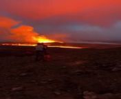 A group of friends went hiking to witness the volcanic eruption that occurred in Grindavik, Iceland. They saw lava spewing out and creating a beautiful orange hue in the sky. A few other people were also present at the spot to witness the volcano.&#60;br/&#62;&#60;br/&#62;The underlying music rights are not available for license. For use of the video with the track(s) contained therein, please contact the music publisher(s) or relevant rightsholder(s).