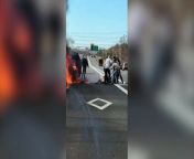 This is the moment heroic bystanders risked their own lives to rescue a 56-year-old woman from her burning vehicle on a New York state highway.&#60;br/&#62;&#60;br/&#62;Video footage shows the moment the woman was pulled from the burning car and dragged across lanes of traffic away from the inferno.&#60;br/&#62;&#60;br/&#62;The good samaritan rescuers then carried her away after wrapping her in pieces of clothing.&#60;br/&#62;&#60;br/&#62;The woman, from Farmingville, New York, USA, is now in critical condition at hospital.&#60;br/&#62;&#60;br/&#62;The filmer said: &#92;