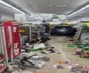 This wrecker service technician was dispatched to this general store to salvage some damage. When they came in, they learned that this car had driven all the way inside this store, causing extensive damage to the aisles.