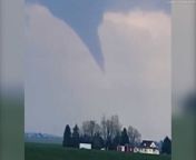 Funnel clouds and possible tornados were spotted as high winds buffeted parts of the Midwest in the United States. &#60;br/&#62;&#60;br/&#62;Videos taken near Humphrey and Monroe in Nebraska show menacing funnel clouds forming into possible tornados. &#60;br/&#62;&#60;br/&#62;One video, taken near Monroe, shows two funnels descending from the same cloud while another shows a funnel fully descended. &#60;br/&#62;&#60;br/&#62;In Humphrey, locals spotted a large funnel descending from a cloud directly above what appeared to be homes.