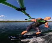 A man mounted a camera on his handle and captured uniquely cool angles of himself wakeboarding. As he sailed across the water, he pulled off an impressive sideflip. He then leaned down and brushed the surface of the water with his hand as the motorboat pulled him onwards.